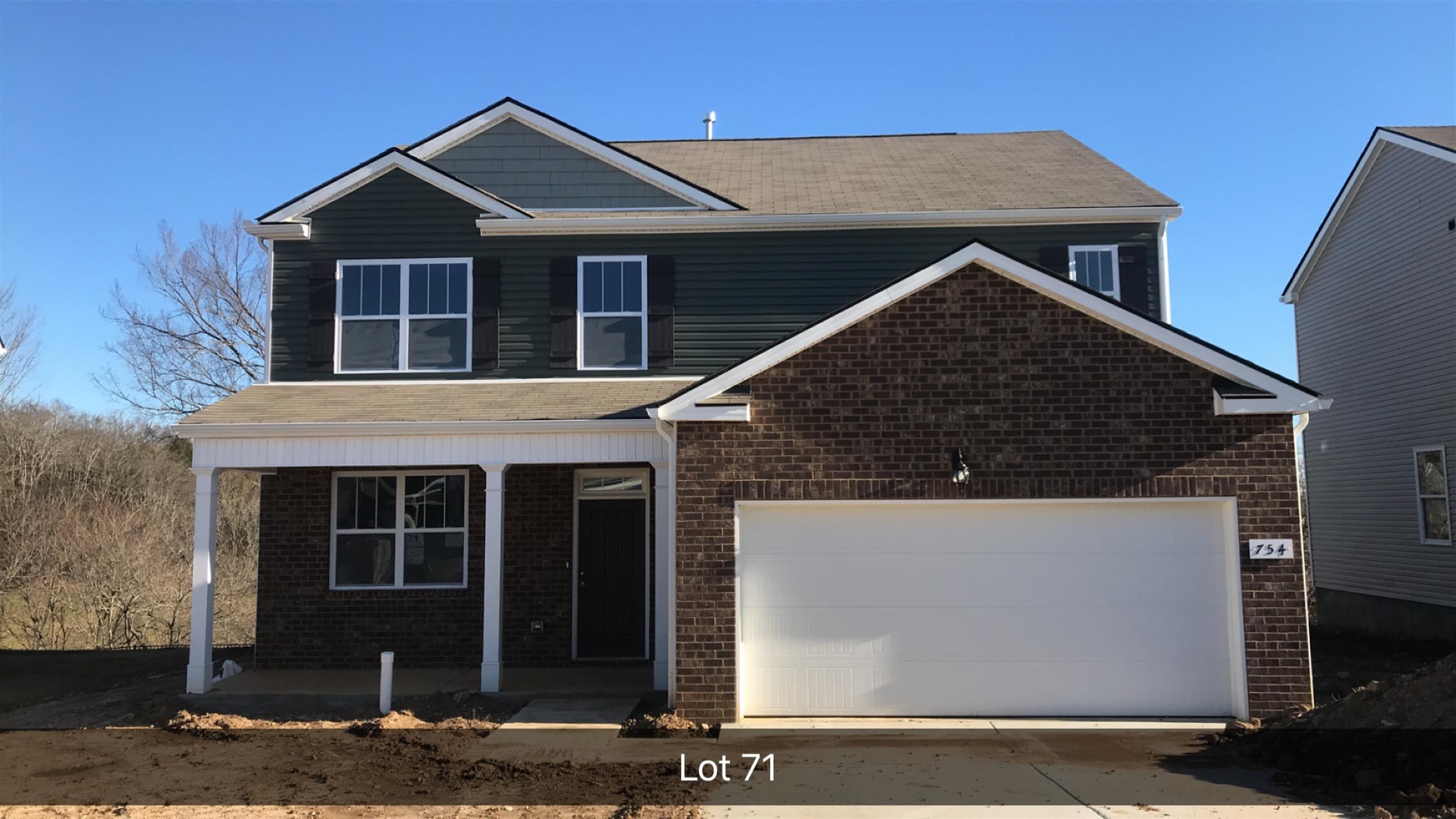 754 Prominence Road, Unit 71 Columbia, TN 38401 - Photo 1 of 28 a front view of a house with garden
