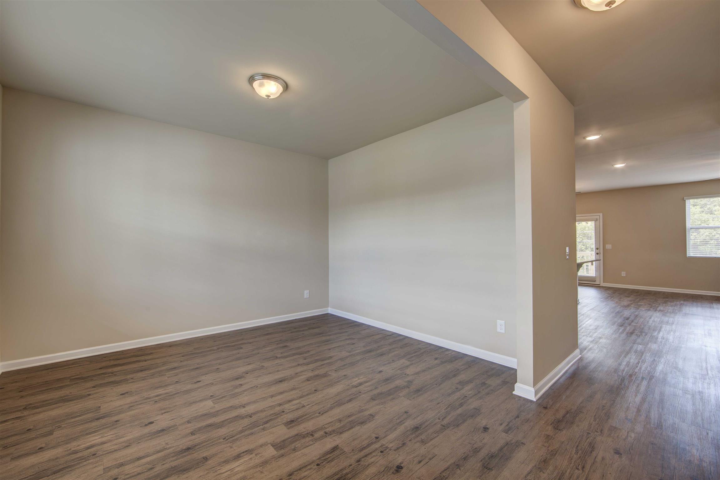 754 Prominence Road, Unit 71 Columbia, TN 38401 - Photo 7 of 28 a view of an empty room with wooden floor and closet