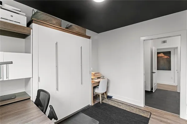 a bedroom with a bed and a tv