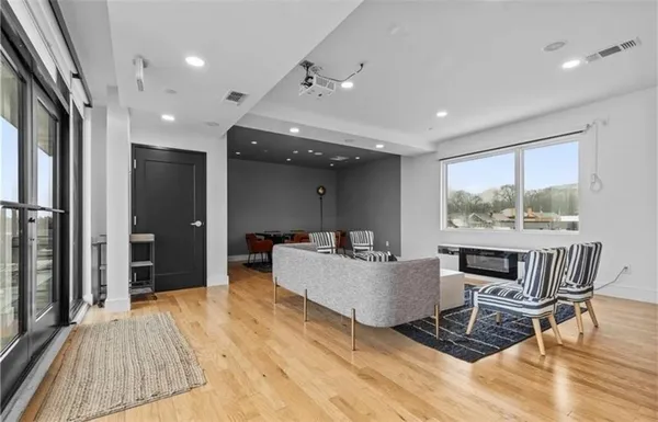 a living room with furniture and a rug
