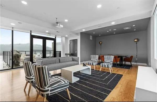 a outdoor space with furniture a flat screen tv