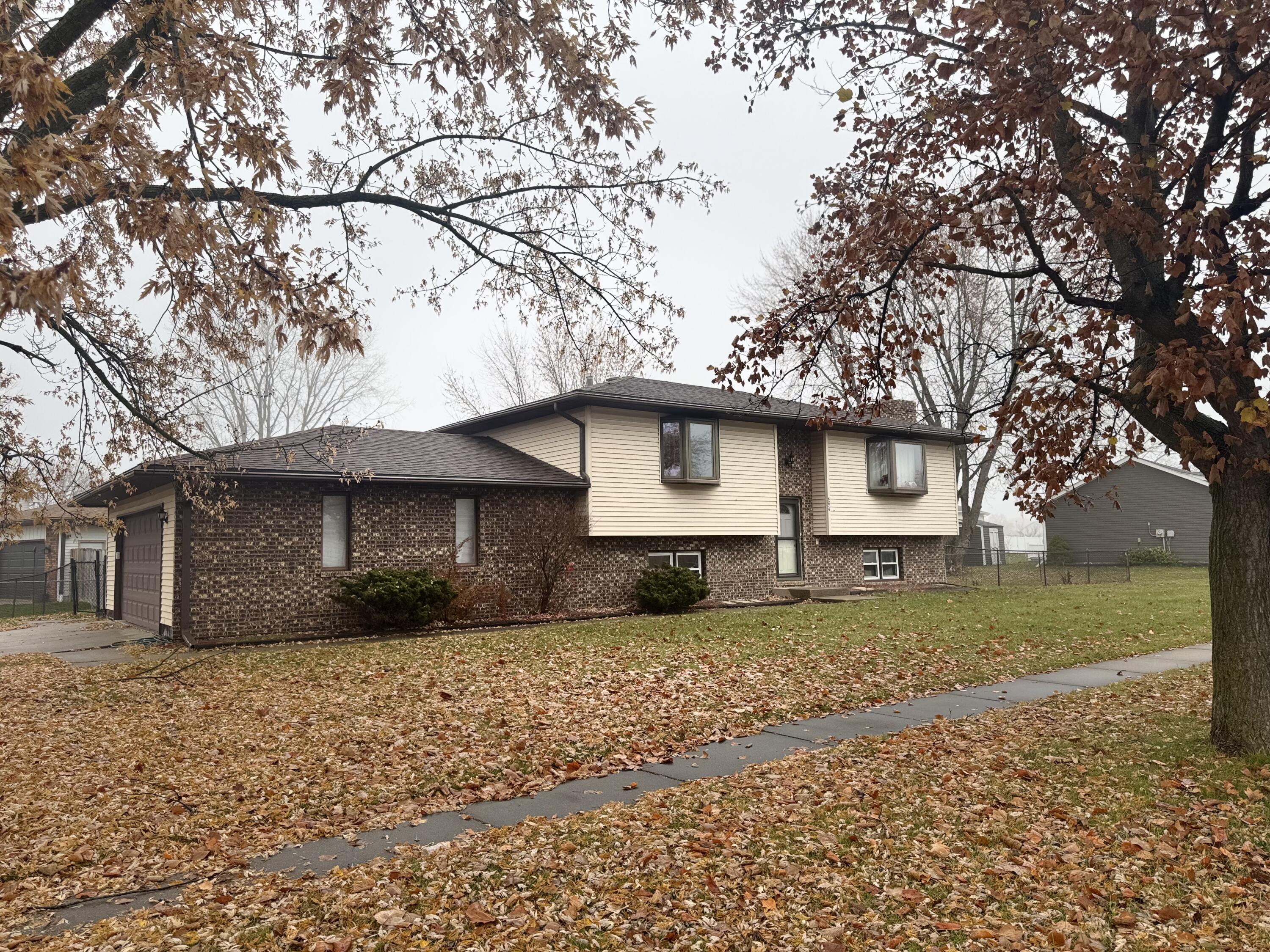 6276 Robbins Road Portage, IN 46368 - Photo 2 of 3 a front view of a house with a garden