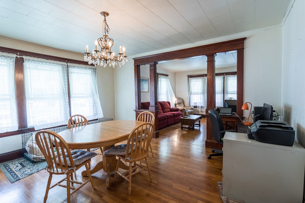 96-98 Johnson Street Springfield, MA 01108 - Photo 12 of 38 a living room with furniture a chandelier and a chandelier