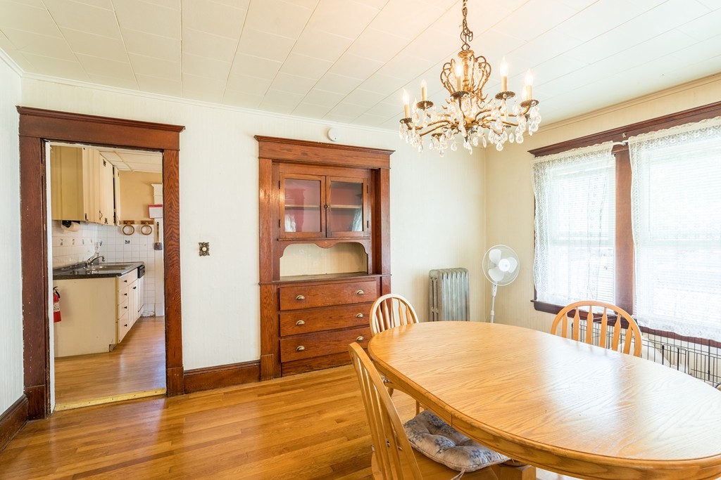 96-98 Johnson Street Springfield, MA 01108 - Photo 13 of 38 a view of a dining room with furniture window and wooden floor