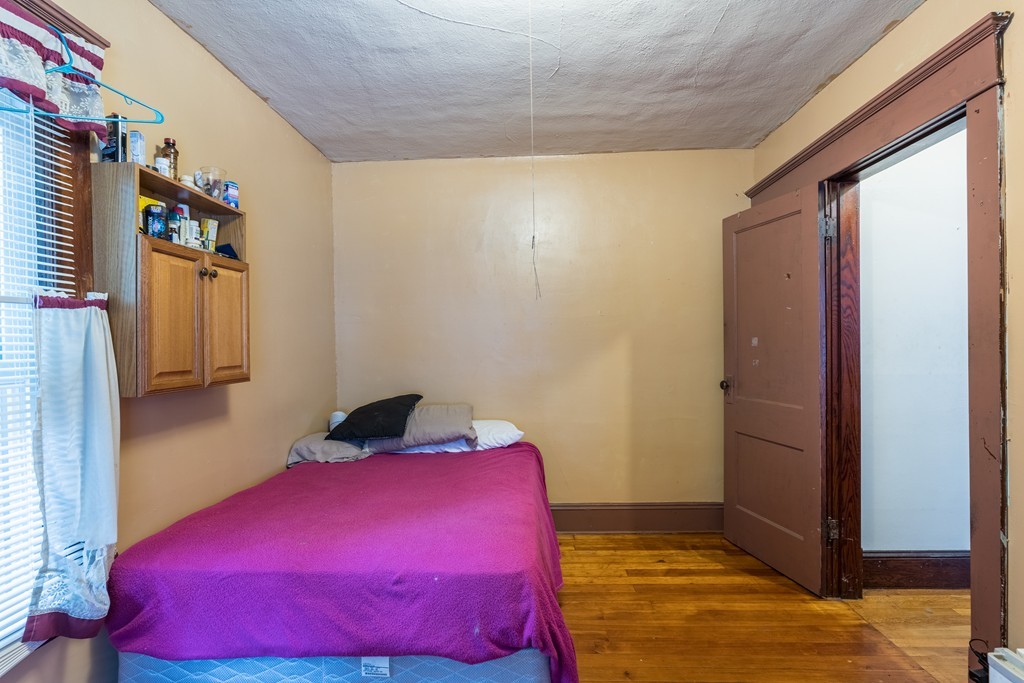 96-98 Johnson Street Springfield, MA 01108 - Photo 14 of 38 a bedroom with a bed and a closet