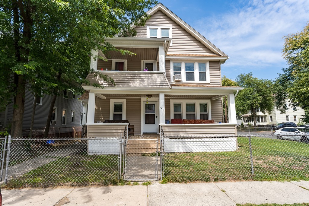 96-98 Johnson Street Springfield, MA 01108 - Photo 2 of 38 a front view of a house with a yard