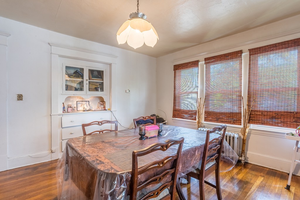 96-98 Johnson Street Springfield, MA 01108 - Photo 23 of 38 a view of a dining room with furniture window and wooden floor