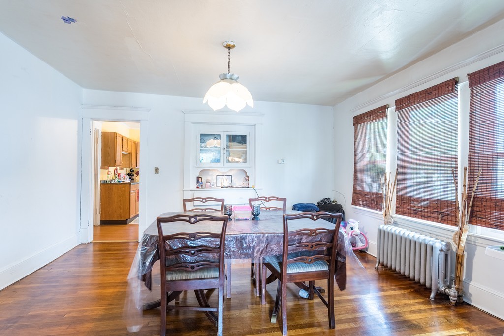 96-98 Johnson Street Springfield, MA 01108 - Photo 24 of 38 a view of a dining room with furniture window and wooden floor