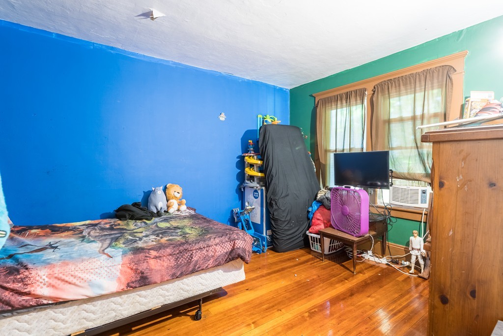96-98 Johnson Street Springfield, MA 01108 - Photo 29 of 38 a bedroom with a bed chair and a window
