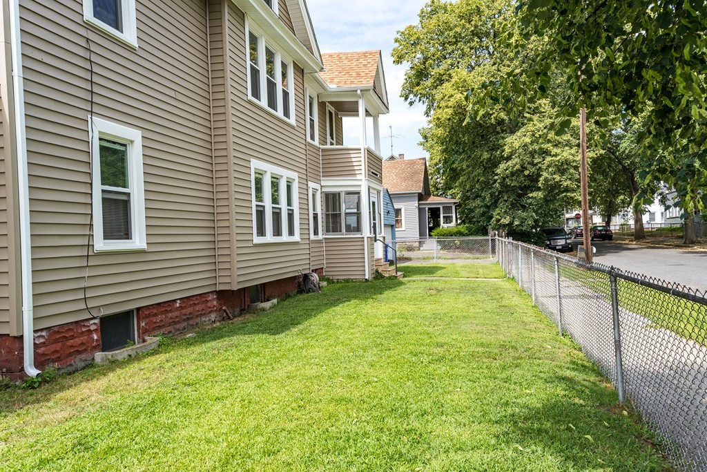 96-98 Johnson Street Springfield, MA 01108 - Photo 34 of 38 a view of a house with a yard and sitting area