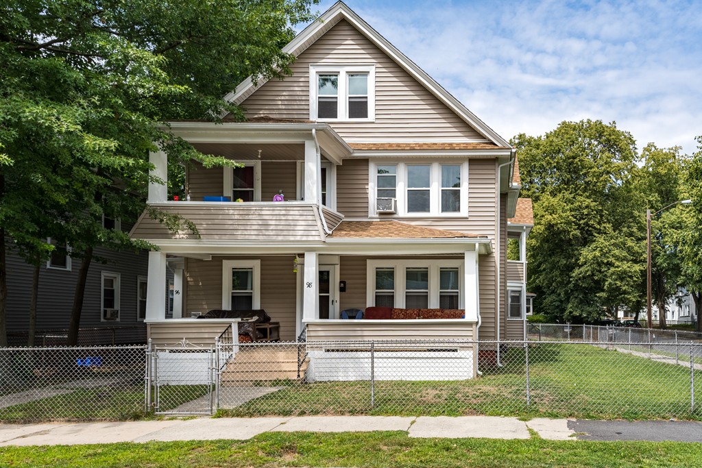 96-98 Johnson Street Springfield, MA 01108 - Photo 38 of 38 a front view of a house with a yard