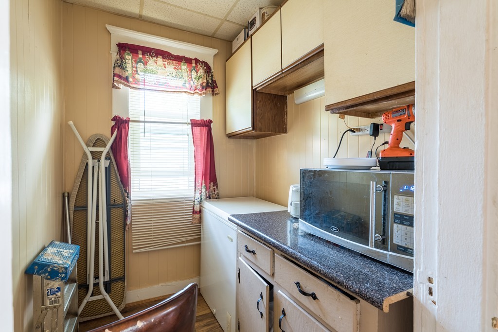 96-98 Johnson Street Springfield, MA 01108 - Photo 6 of 38 a kitchen with stainless steel appliances granite countertop a refrigerator and a sink