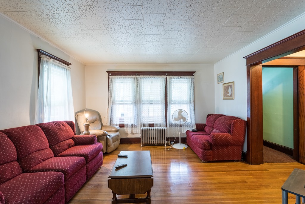 96-98 Johnson Street Springfield, MA 01108 - Photo 8 of 38 a living room with furniture or couch and a large window