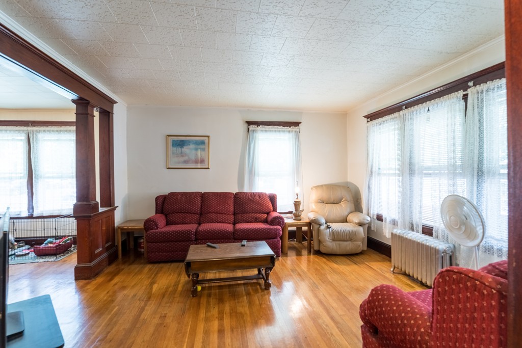 96-98 Johnson Street Springfield, MA 01108 - Photo 9 of 38 a living room with furniture and a wooden floor