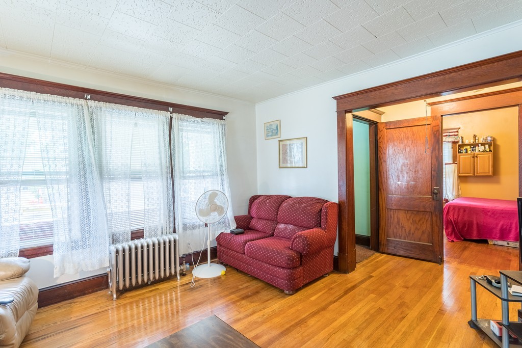 96-98 Johnson Street Springfield, MA 01108 - Photo 10 of 38 a bedroom with furniture and wooden floor