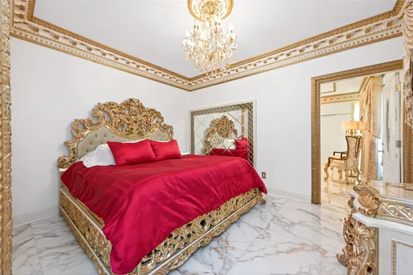 a room with lots of furniture and a chandelier
