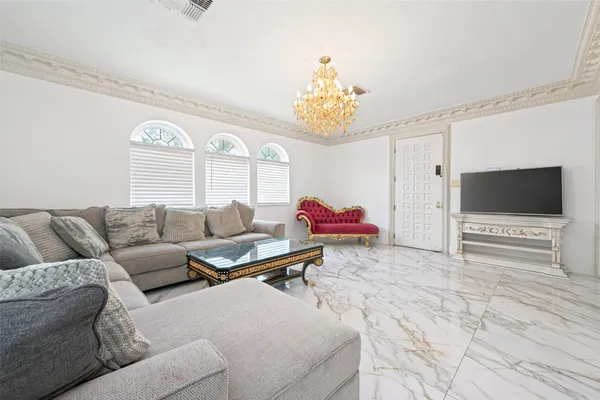 a bedroom with a bed and a chair