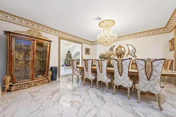 a view of a livingroom with furniture and chandelier