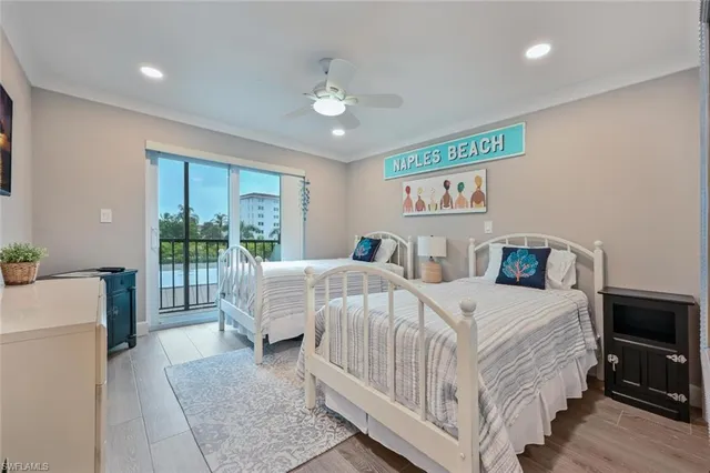 a bedroom with double bed and a large window