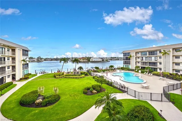 a view of a swimming pool with outdoor seating space