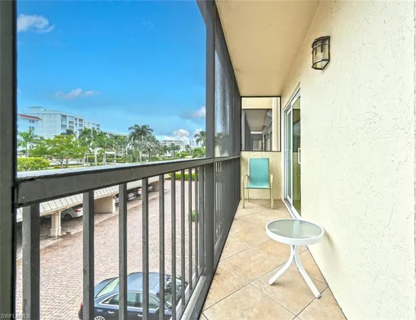 a view of a balcony with wooden floor