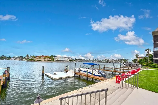 a view of swimming pool with outdoor seating and city view