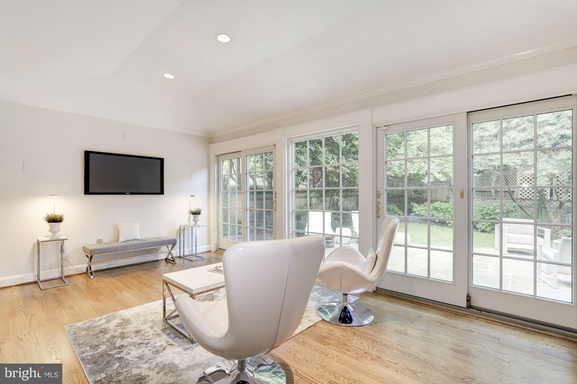 2205 46th Street Northwest Washington, DC 20007 - Photo 12 of 30 a living room with furniture and a flat screen tv