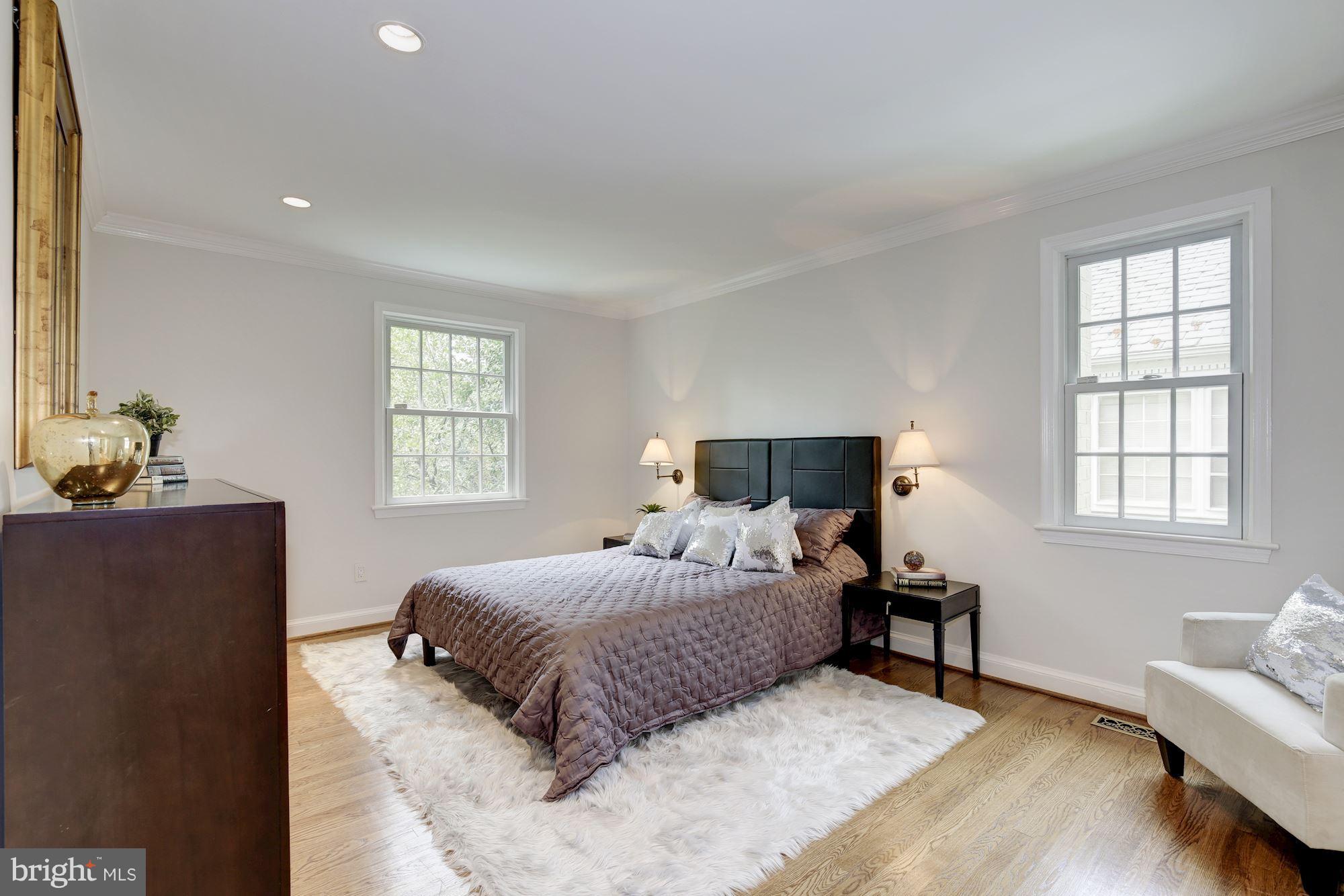2205 46th Street Northwest Washington, DC 20007 - Photo 13 of 30 a bedroom with a bed and wooden floor