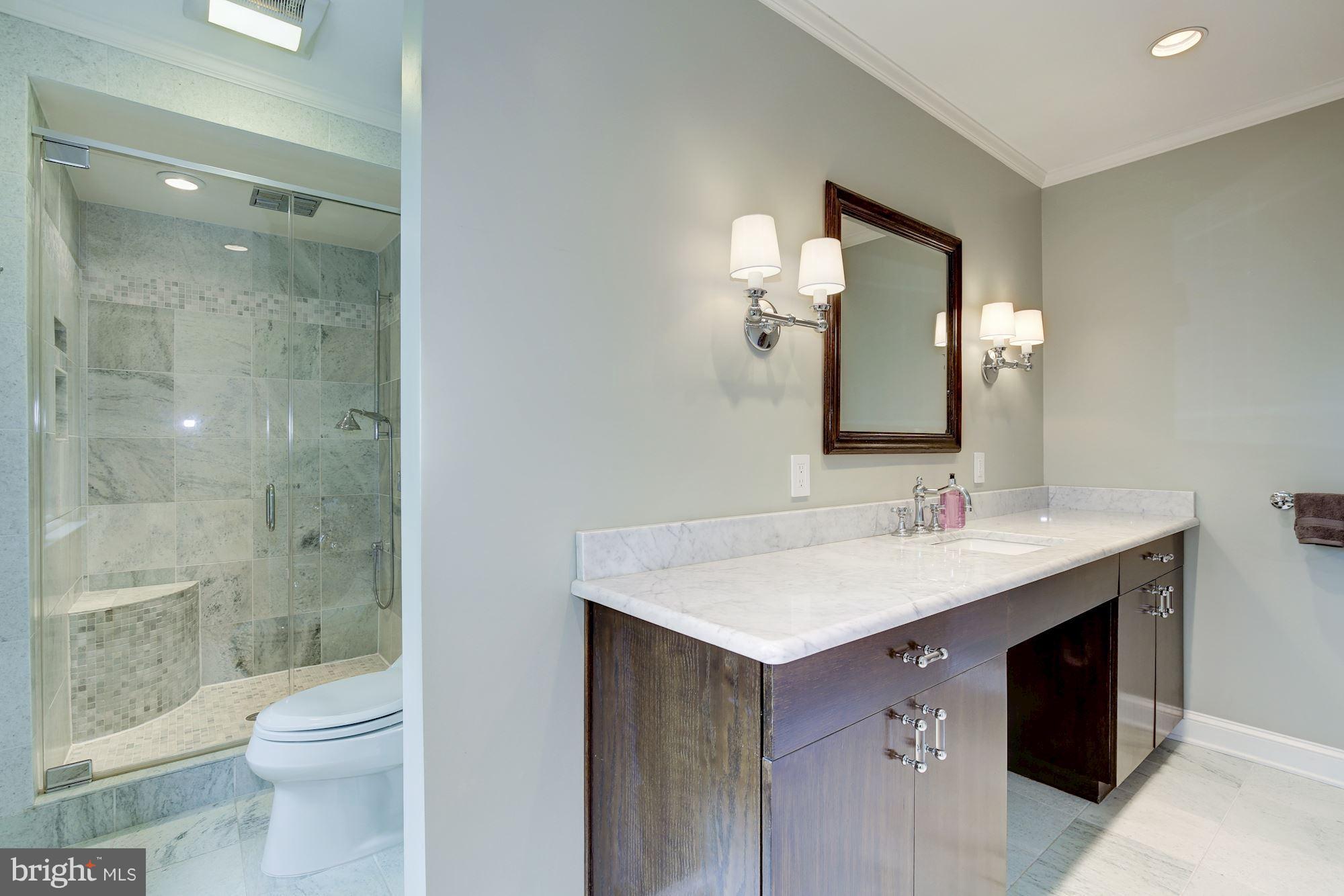 2205 46th Street Northwest Washington, DC 20007 - Photo 17 of 30 a bathroom with a sink a toilet and shower
