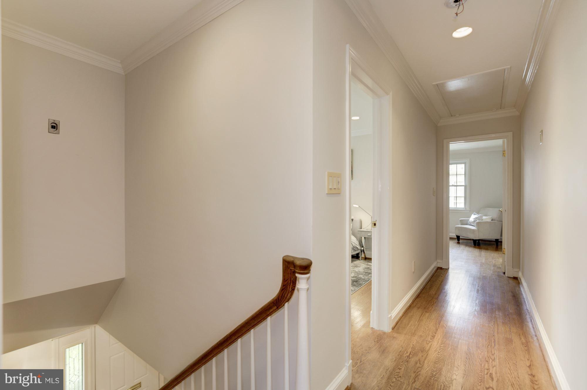 2205 46th Street Northwest Washington, DC 20007 - Photo 22 of 30 a view of a room with wooden floor and staircase