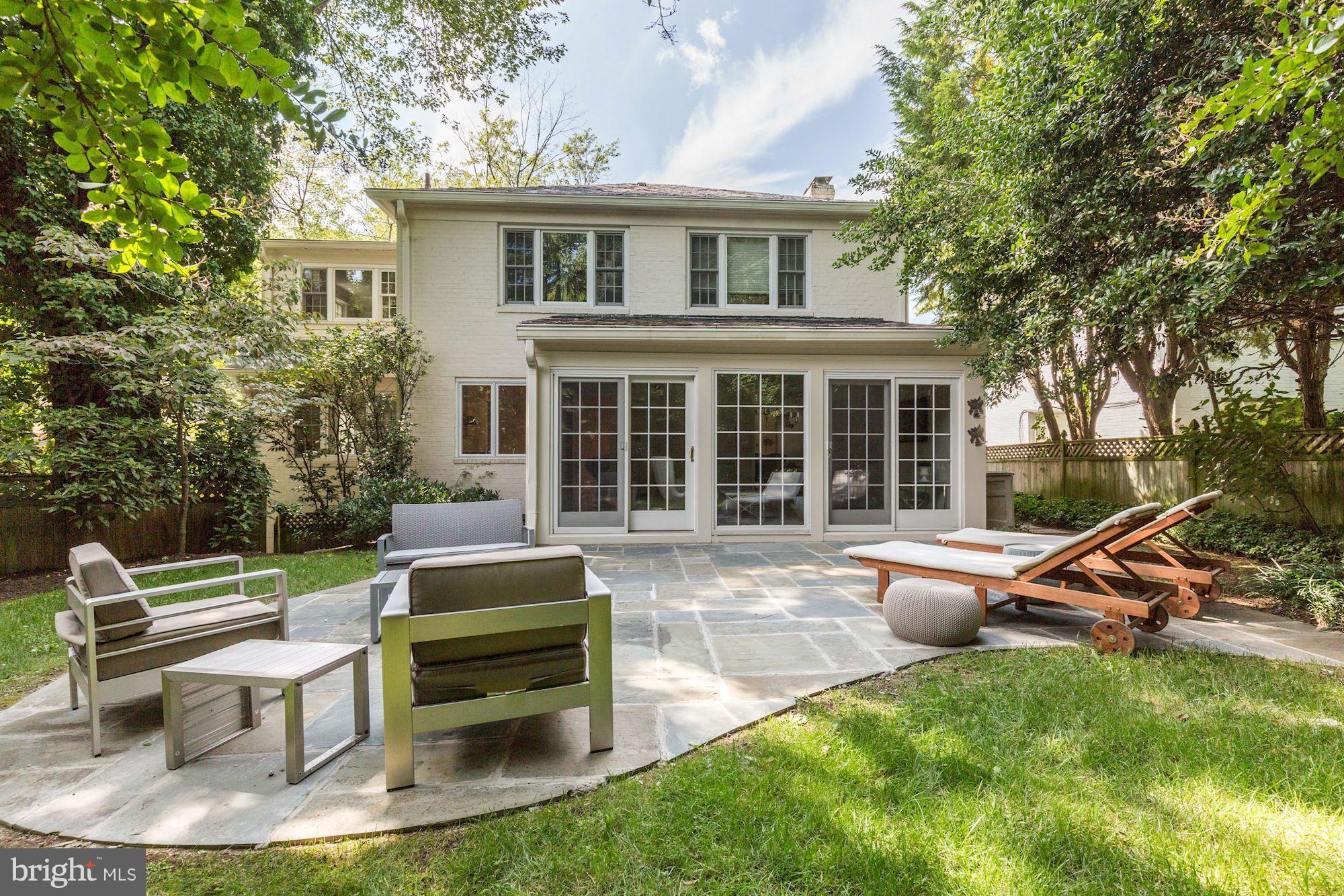 2205 46th Street Northwest Washington, DC 20007 - Photo 28 of 30 a backyard of a house with table and chairs