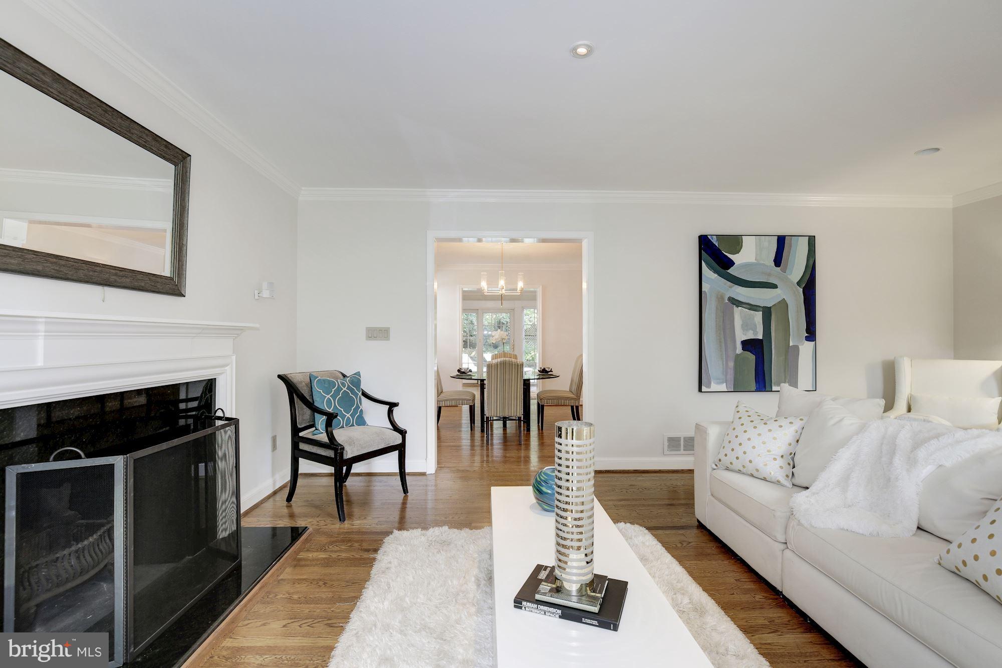 2205 46th Street Northwest Washington, DC 20007 - Photo 4 of 30 a living room with furniture and a fireplace