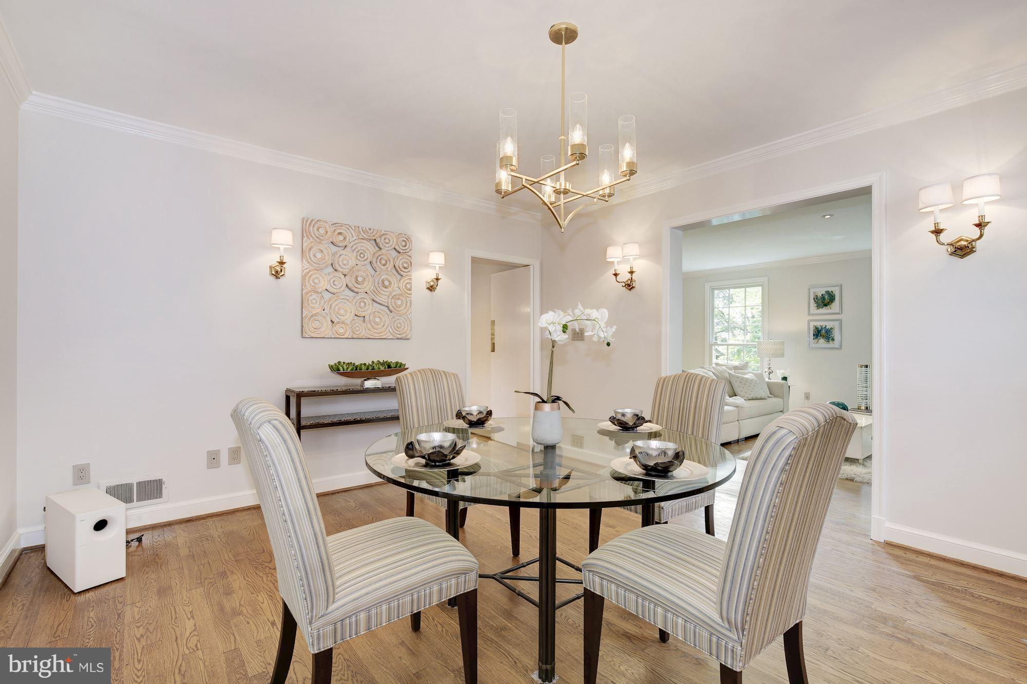 2205 46th Street Northwest Washington, DC 20007 - Photo 7 of 30 a view of a dining room with furniture and wooden floor