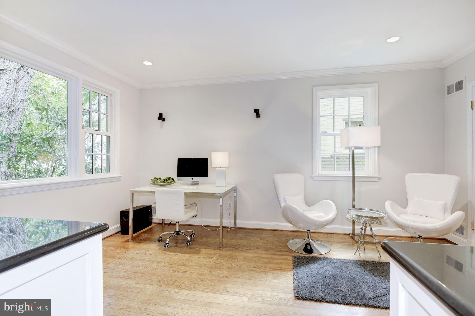 2205 46th Street Northwest Washington, DC 20007 - Photo 10 of 30 a living room with furniture a window and a table