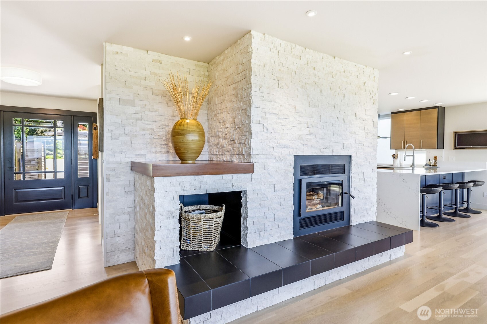37709 Olympic View Road Northeast Hansville, WA 98340 - Photo 11 of 40 a living room with furniture and a fireplace