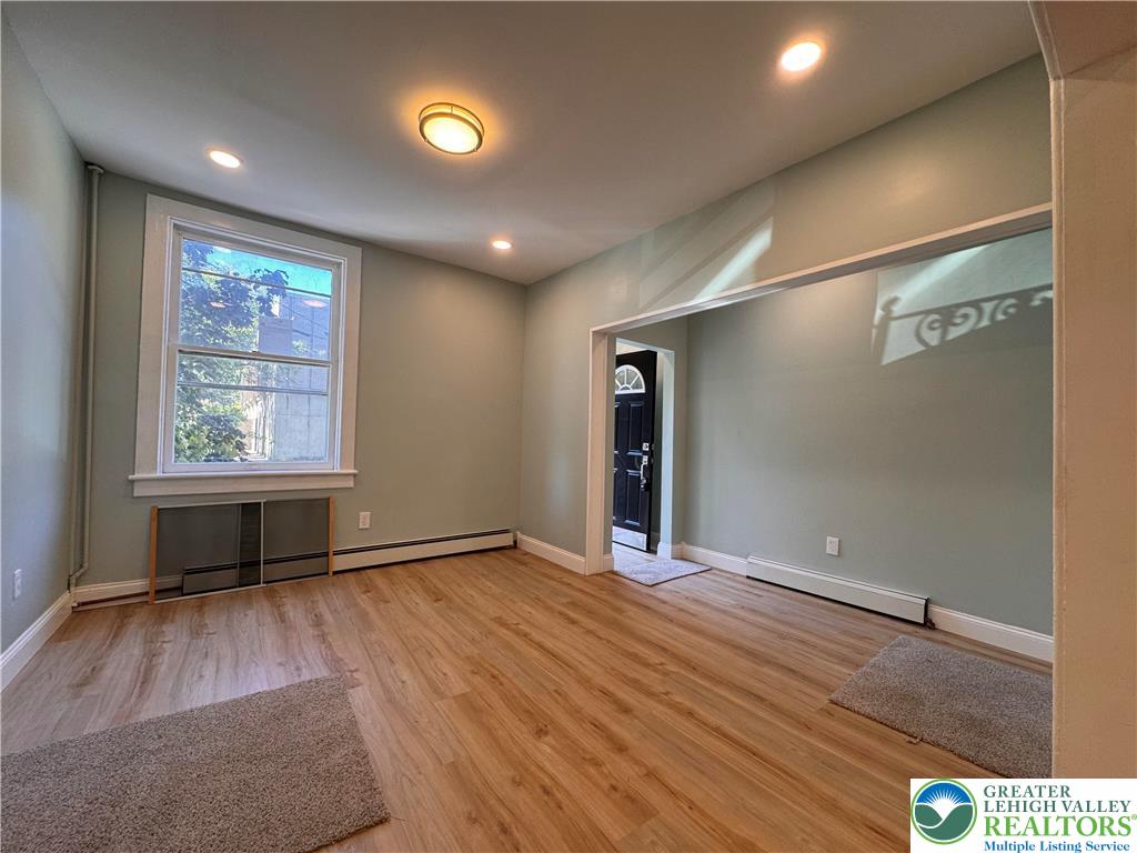 35 North 5th Street Easton, PA 18042 - Photo 14 of 96 an empty room with wooden floor and windows