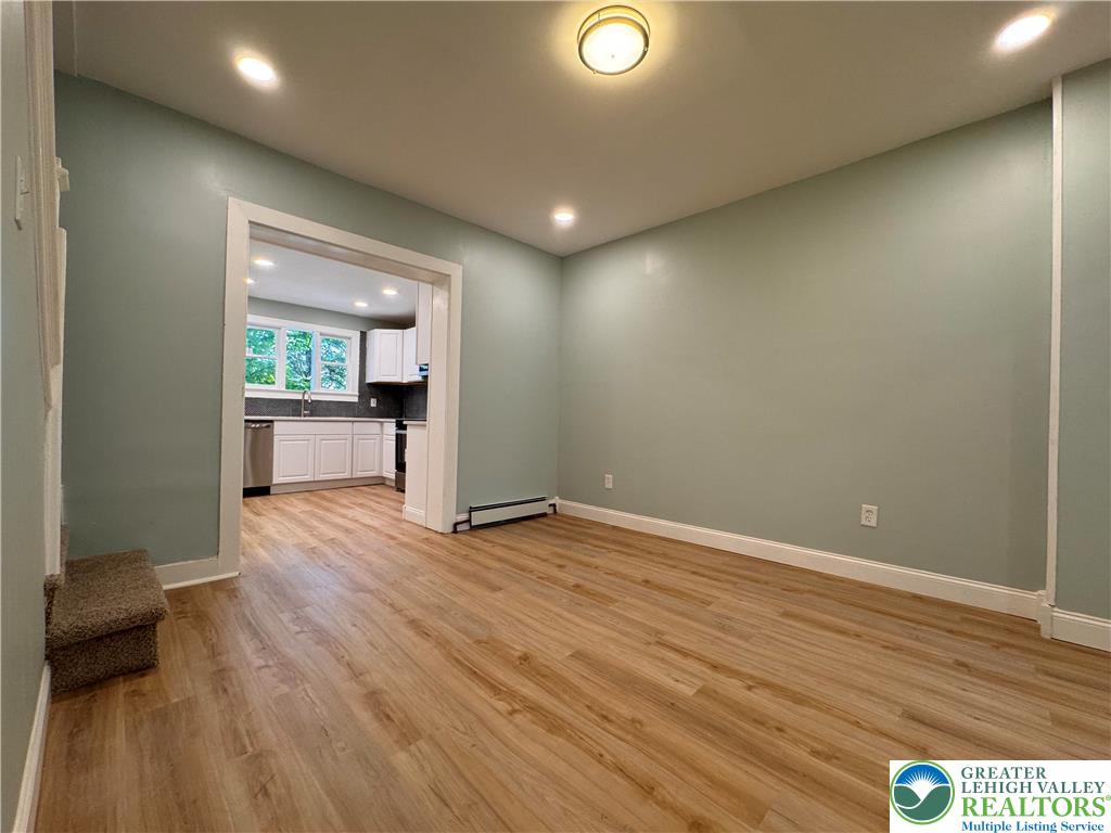 35 North 5th Street Easton, PA 18042 - Photo 16 of 96 an empty room with wooden floor and windows