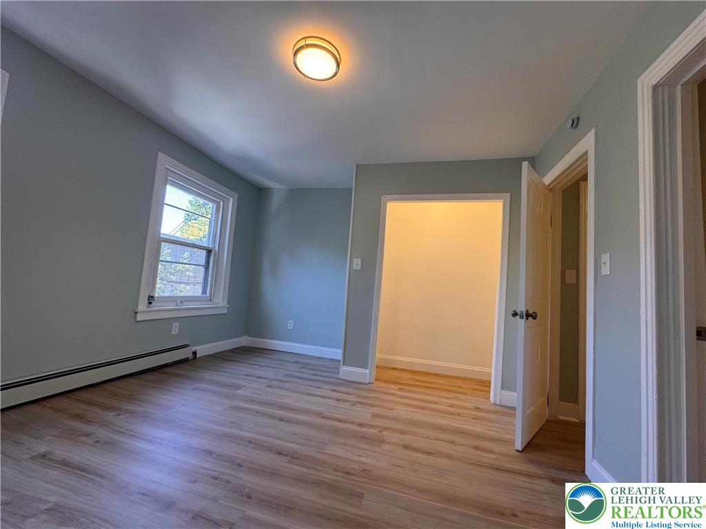 35 North 5th Street Easton, PA 18042 - Photo 50 of 96 an empty room with wooden floor and windows