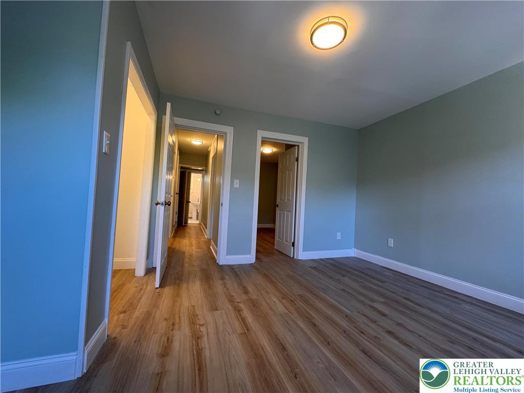 35 North 5th Street Easton, PA 18042 - Photo 53 of 96 a view of an empty room with wooden floor and a window
