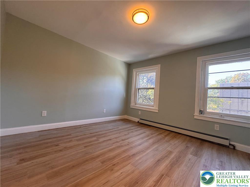 35 North 5th Street Easton, PA 18042 - Photo 54 of 96 an empty room with wooden floor and windows