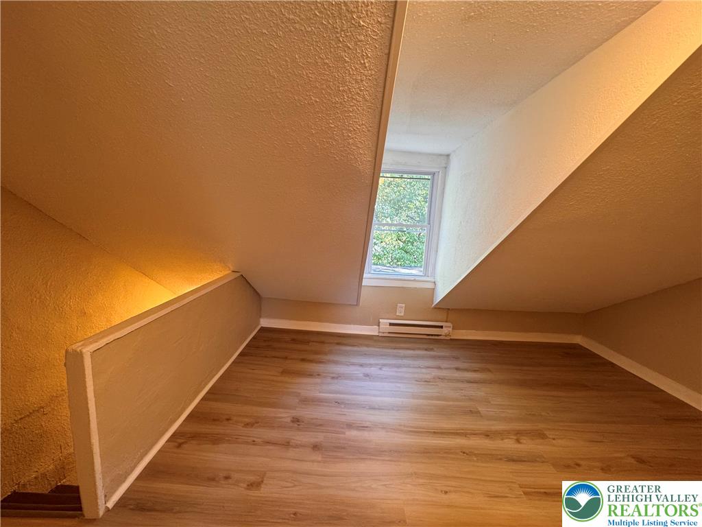 35 North 5th Street Easton, PA 18042 - Photo 60 of 96 a view of an empty room with wooden floor and a window