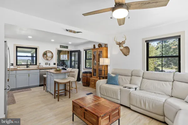 a large kitchen with a table and chairs