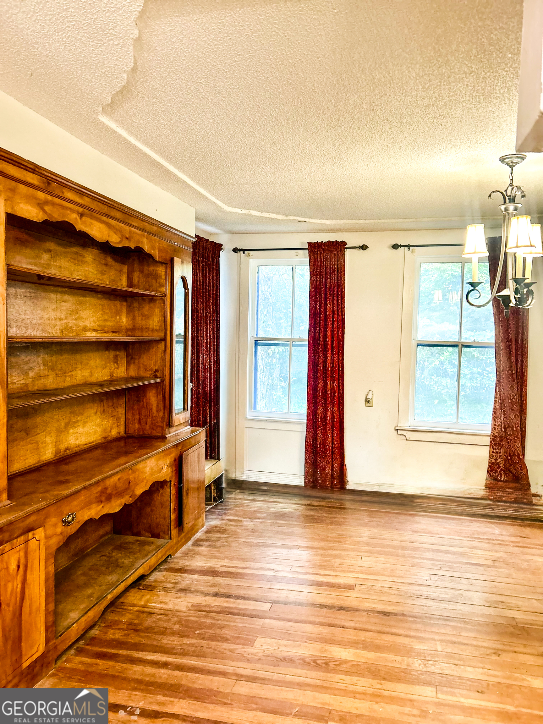 2123 Ellis Street Brunswick, GA 31520 - Photo 11 of 19 a view of room with wooden floor and windows