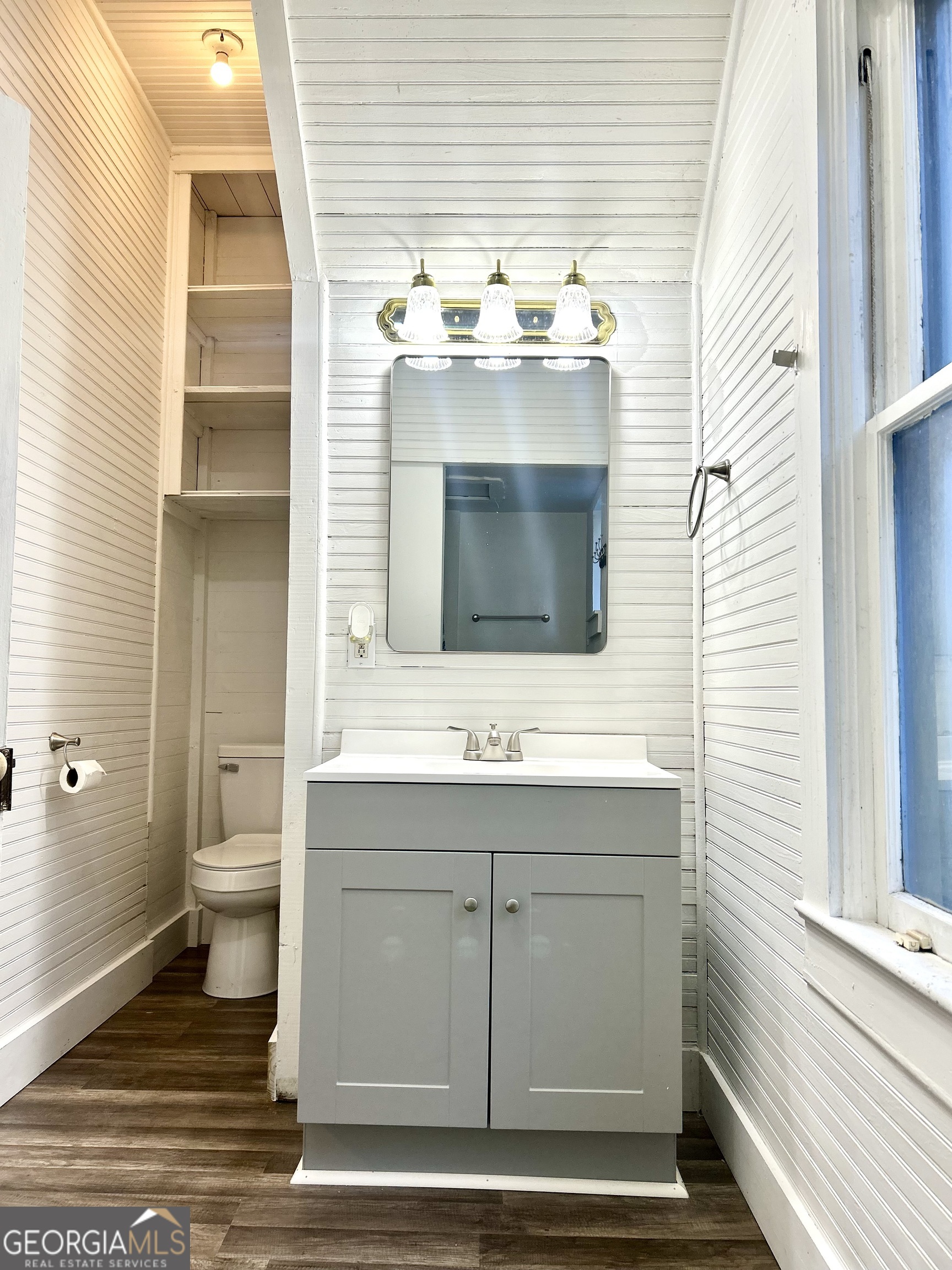 2123 Ellis Street Brunswick, GA 31520 - Photo 16 of 19 a bathroom with a sink and a mirror