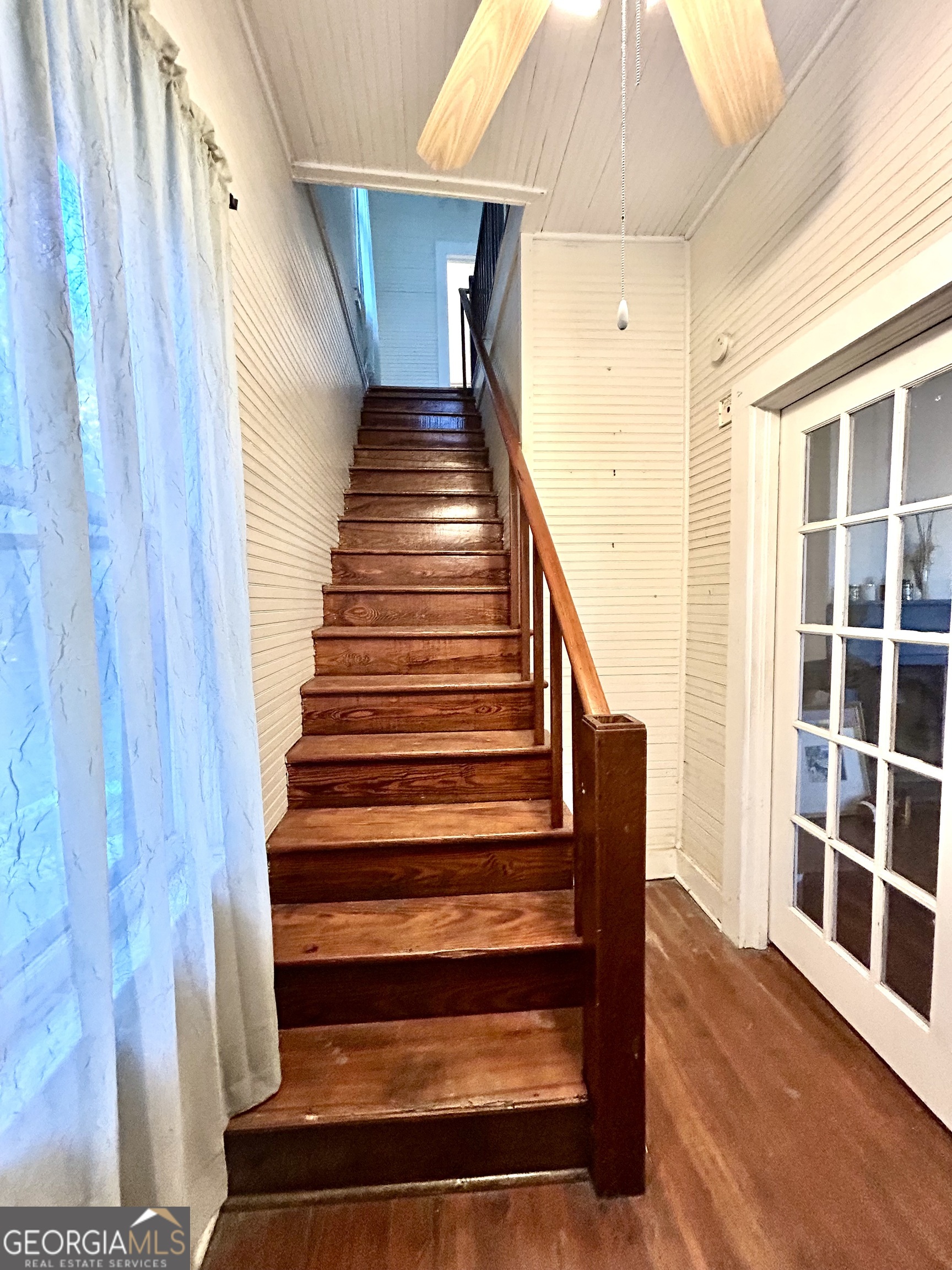 2123 Ellis Street Brunswick, GA 31520 - Photo 17 of 19 a view of entryway with wooden floor and stairs