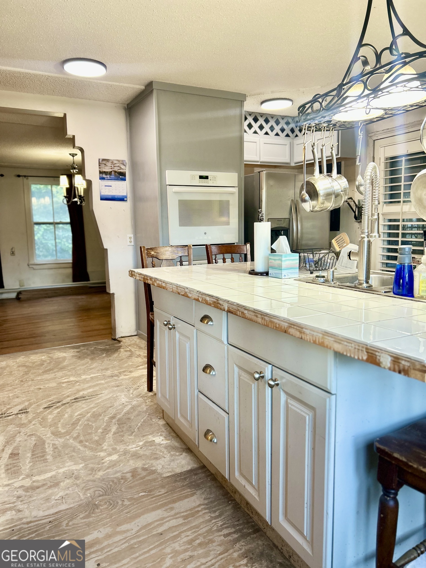 2123 Ellis Street Brunswick, GA 31520 - Photo 8 of 19 a large kitchen with a lot of counter space and wooden floor
