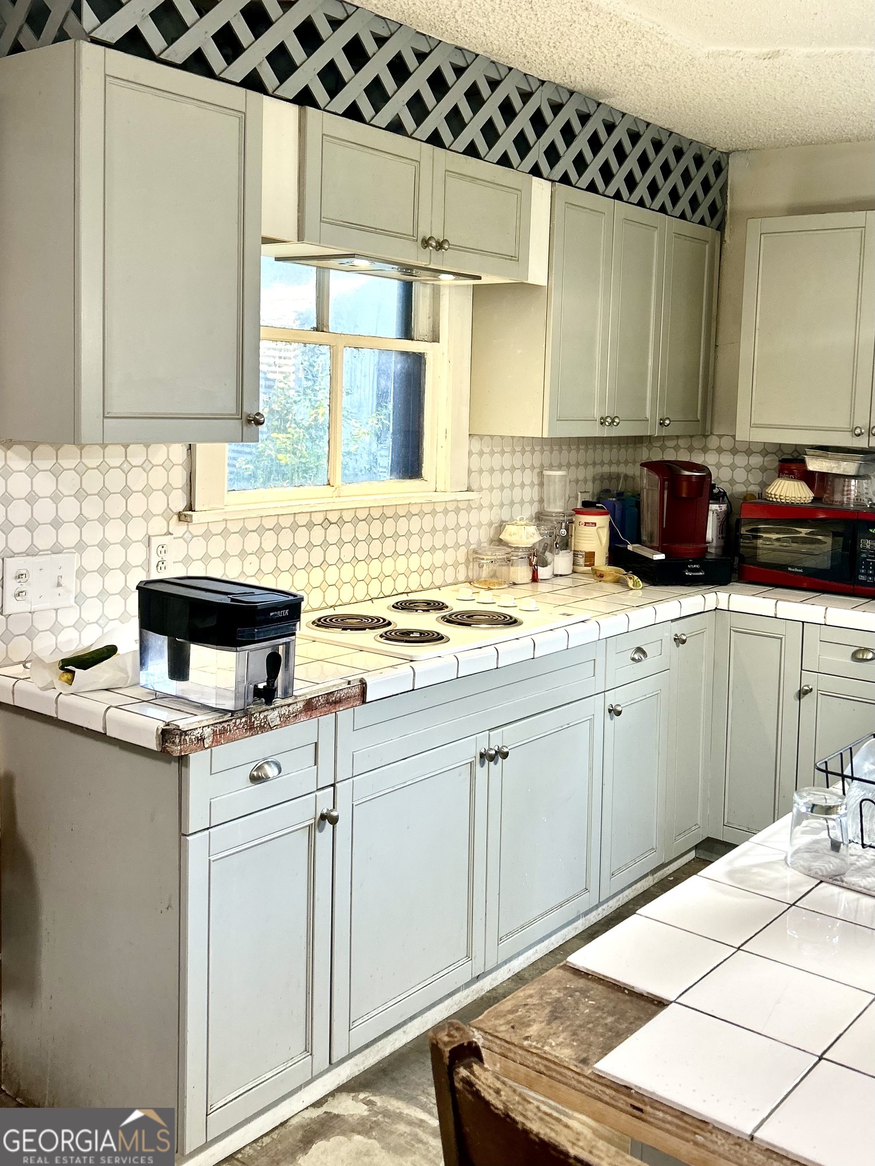 2123 Ellis Street Brunswick, GA 31520 - Photo 10 of 19 a kitchen with a sink and cabinets