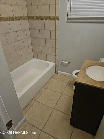 a bathroom with a sink and a bathtub