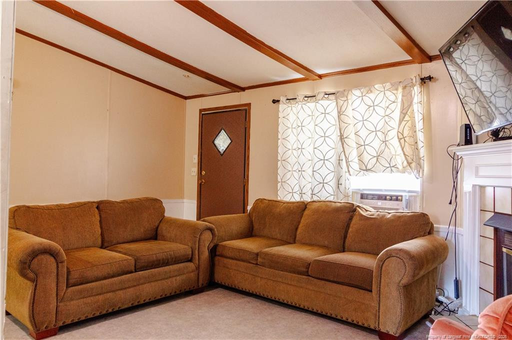 231 Knight Lane Autryville, NC 28318 - Photo 15 of 27 a living room with furniture and a window