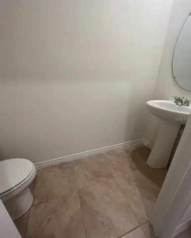 a bathroom with a toilet and a sink